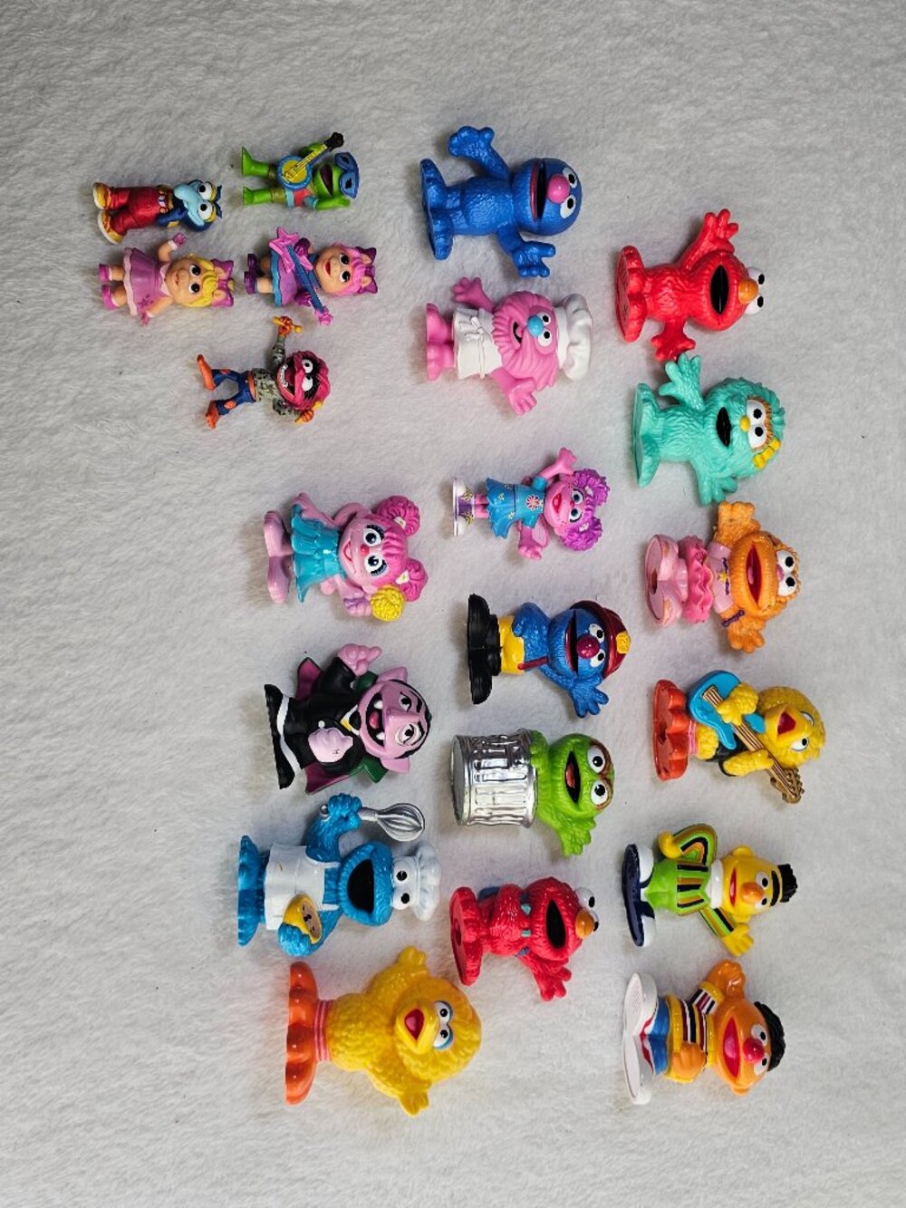 Collection of Sesame Street and Disney Junior Muppet Babies toy figurines